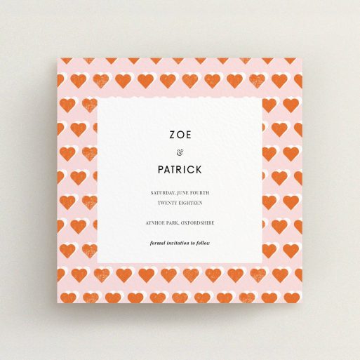 A wedding save the date card called "Rustic Hearts". It is a square (148mm x 148mm) card in a square orientation. "Rustic Hearts" is available as a flat card, with tones of pink and orange.