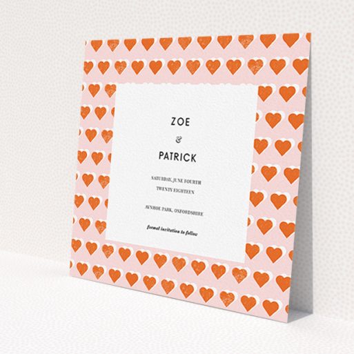 A wedding save the date card called 'Rustic Hearts'. It is a square (148mm x 148mm) card in a square orientation. 'Rustic Hearts' is available as a flat card, with tones of pink and orange.