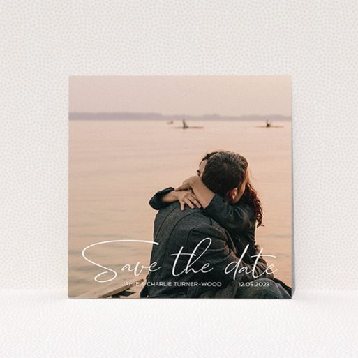 A wedding save the date card design called "Salamanca". It is a square (148mm x 148mm) card in a square orientation. It is a photographic wedding save the date card with room for 1 photo. "Salamanca" is available as a flat card, with mainly white colouring.