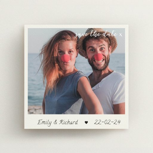 A wedding save the date card called "Save the Date by Hand". It is a square (148mm x 148mm) card in a square orientation. It is a photographic wedding save the date card with room for 1 photo. "Save the Date by Hand" is available as a flat card, with tones of cream and navy blue.