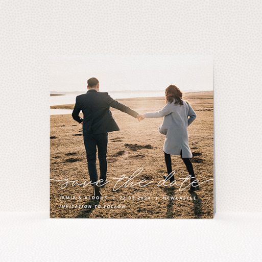 A wedding save the date card design called "Save the Date Script". It is a square (148mm x 148mm) card in a square orientation. It is a photographic wedding save the date card with room for 1 photo. "Save the Date Script" is available as a flat card, with mainly white colouring.