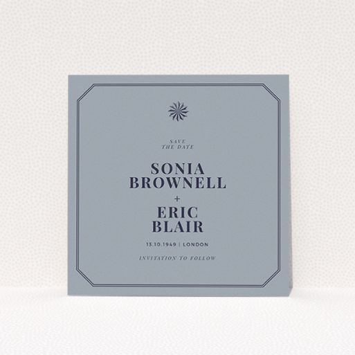 A wedding save the date card called "Shaded sundial". It is a square (148mm x 148mm) card in a square orientation. "Shaded sundial" is available as a flat card, with tones of dark grey and navy blue.