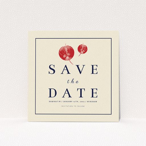 A wedding save the date card named "Shanghai Nights". It is a square (148mm x 148mm) card in a square orientation. "Shanghai Nights" is available as a flat card, with tones of cream and navy blue.