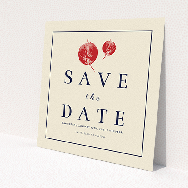 A wedding save the date card named 'Shanghai Nights'. It is a square (148mm x 148mm) card in a square orientation. 'Shanghai Nights' is available as a flat card, with tones of cream and navy blue.