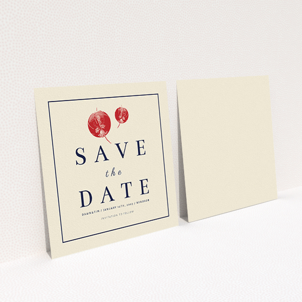 A wedding save the date card named "Shanghai Nights". It is a square (148mm x 148mm) card in a square orientation. "Shanghai Nights" is available as a flat card, with tones of cream and navy blue.