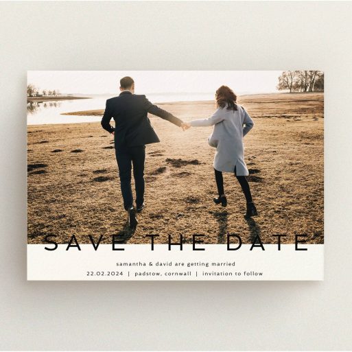 A wedding save the date card called "Simple Saving". It is an A5 card in a landscape orientation. It is a photographic wedding save the date card with room for 1 photo. "Simple Saving" is available as a flat card, with tones of cream and black.