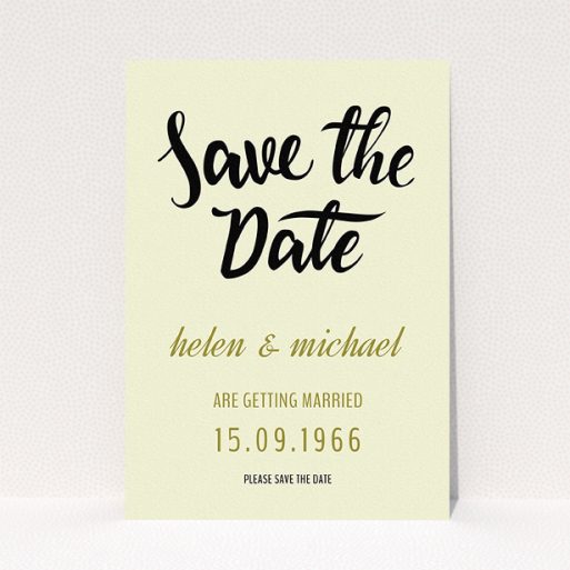 A wedding save the date card called "Simply Black Typography Pen". It is an A5 card in a portrait orientation. "Simply Black Typography Pen" is available as a flat card, with tones of cream, gold and black.