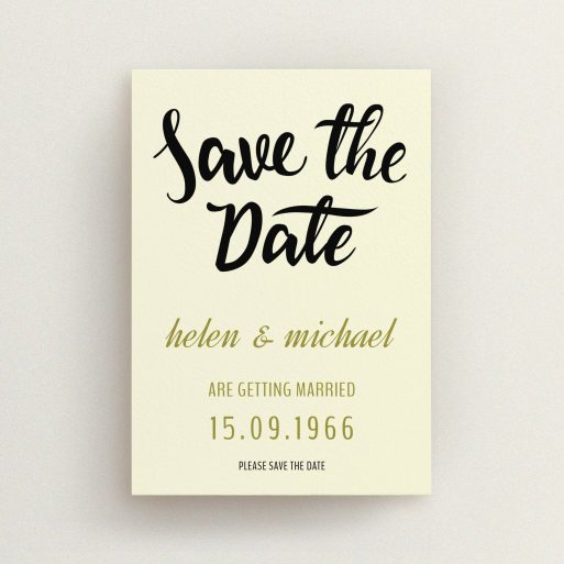 A wedding save the date card called "Simply Black Typography Pen". It is an A6 card in a portrait orientation. "Simply Black Typography Pen" is available as a flat card, with tones of cream, gold and black.