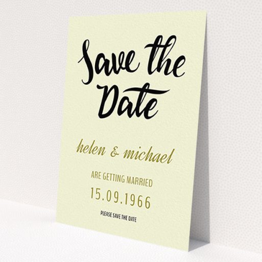 A wedding save the date card called 'Simply Black Typography Pen'. It is an A6 card in a portrait orientation. 'Simply Black Typography Pen' is available as a flat card, with tones of cream, gold and black.