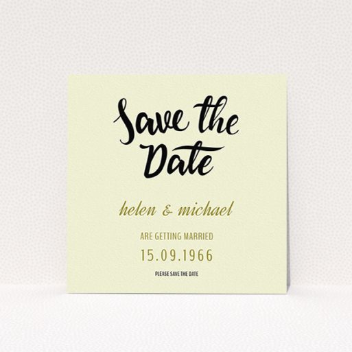 A wedding save the date card named "Simply Black Typography Pen". It is a square (148mm x 148mm) card in a square orientation. "Simply Black Typography Pen" is available as a flat card, with tones of cream, gold and black.