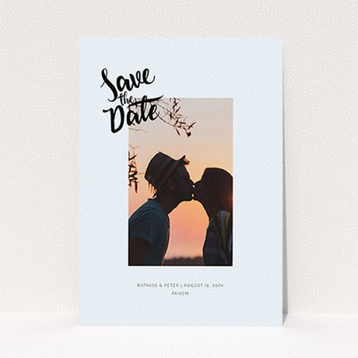 A wedding save the date card design named "Stamp Typography". It is an A6 card in a portrait orientation. It is a photographic wedding save the date card with room for 1 photo. "Stamp Typography" is available as a flat card, with mainly light blue colouring.