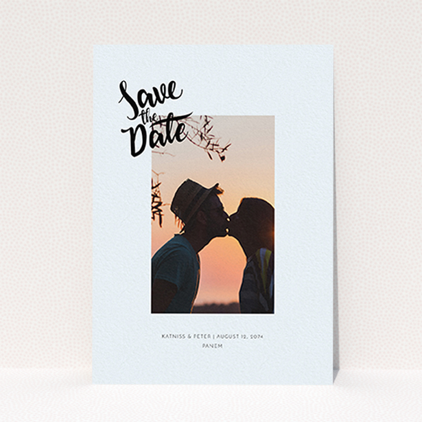 A wedding save the date card design named "Stamp Typography". It is an A6 card in a portrait orientation. It is a photographic wedding save the date card with room for 1 photo. "Stamp Typography" is available as a flat card, with mainly light blue colouring.