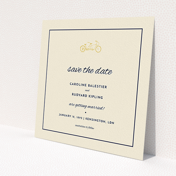 A wedding save the date card design titled 'Tandem sheet'. It is a square (148mm x 148mm) card in a square orientation. 'Tandem sheet' is available as a flat card, with tones of cream and gold.