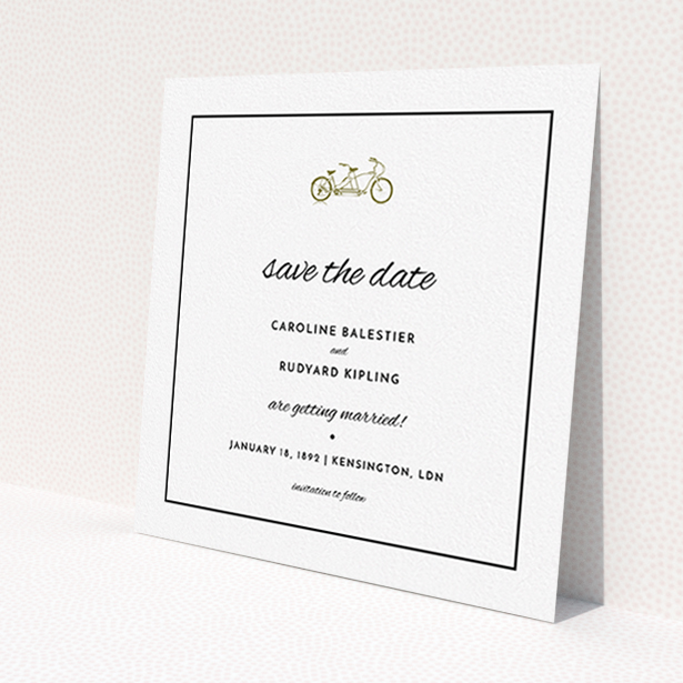 A wedding save the date card named 'Tandem sheet'. It is a square (148mm x 148mm) card in a square orientation. 'Tandem sheet' is available as a flat card, with mainly gold colouring.