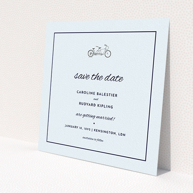 A wedding save the date card design called 'Tandem sheet'. It is a square (148mm x 148mm) card in a square orientation. 'Tandem sheet' is available as a flat card, with tones of light blue and light grey.