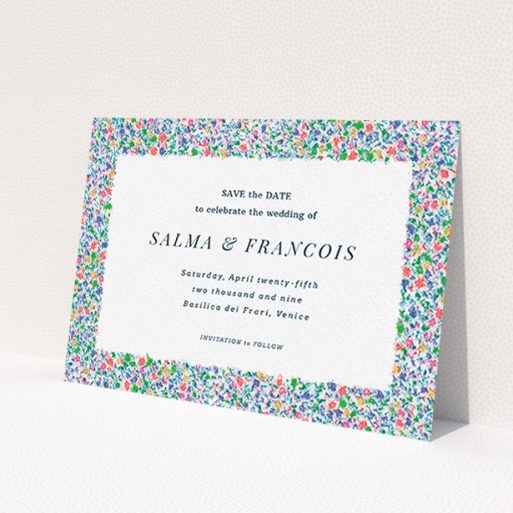 A wedding save the date card called 'The faraway garden'. It is an A6 card in a landscape orientation. 'The faraway garden' is available as a flat card, with tones of white, blue and green.