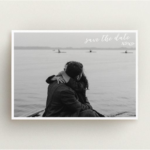 A wedding save the date card design called "Thick White Framed Photo". It is an A5 card in a landscape orientation. It is a photographic wedding save the date card with room for 1 photo. "Thick White Framed Photo" is available as a flat card, with mainly white colouring.