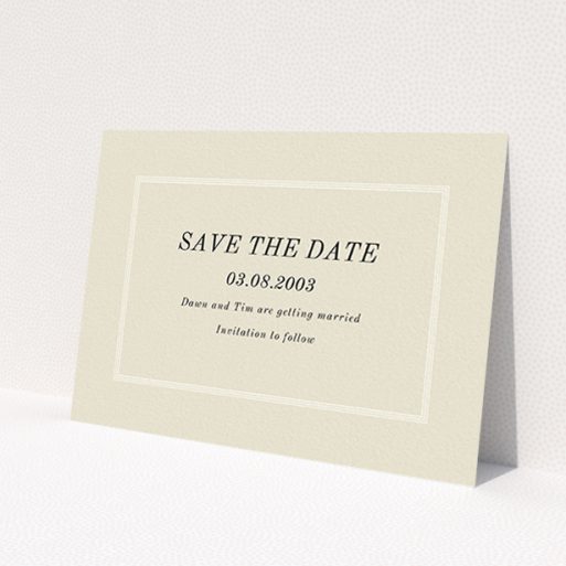 A wedding save the date card design named 'Three line border'. It is an A6 card in a landscape orientation. 'Three line border' is available as a flat card, with mainly dark cream colouring.