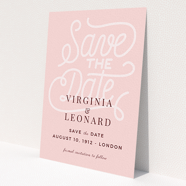 A wedding save the date card design titled 'Typography Backing'. It is an A6 card in a portrait orientation. 'Typography Backing' is available as a flat card, with mainly pink colouring.