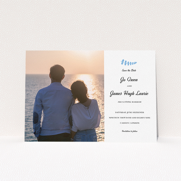 A wedding save the date card design named "Us and blossom". It is an A5 card in a landscape orientation. It is a photographic wedding save the date card with room for 1 photo. "Us and blossom" is available as a flat card, with tones of white and blue.