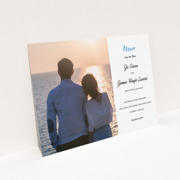 A wedding save the date card design named "Us and blossom". It is an A5 card in a landscape orientation. It is a photographic wedding save the date card with room for 1 photo. "Us and blossom" is available as a flat card, with tones of white and blue.