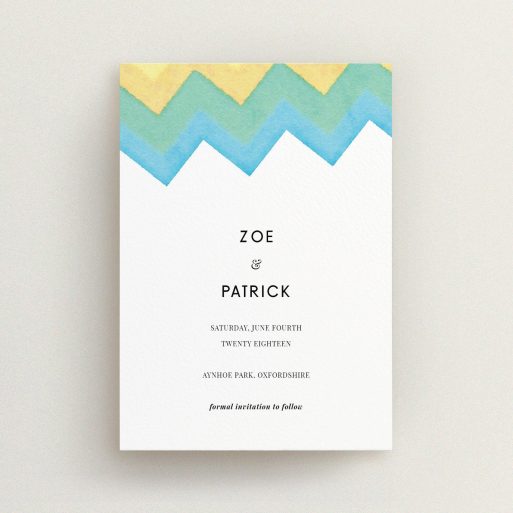 A wedding save the date card design named "Vibrant Peaks". It is an A6 card in a portrait orientation. "Vibrant Peaks" is available as a flat card, with tones of white, blue and green.