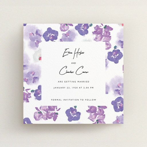 A wedding save the date card design named "Violet Explosion". It is a square (148mm x 148mm) card in a square orientation. "Violet Explosion" is available as a flat card, with mainly purple/dark pink colouring.