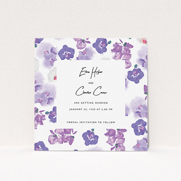 A wedding save the date card design named "Violet Explosion". It is a square (148mm x 148mm) card in a square orientation. "Violet Explosion" is available as a flat card, with mainly purple/dark pink colouring.