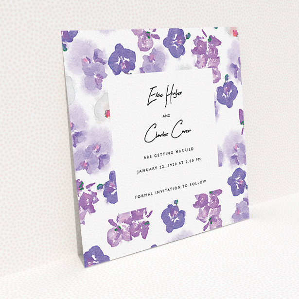 A wedding save the date card design named "Violet Explosion". It is a square (148mm x 148mm) card in a square orientation. "Violet Explosion" is available as a flat card, with mainly purple/dark pink colouring.