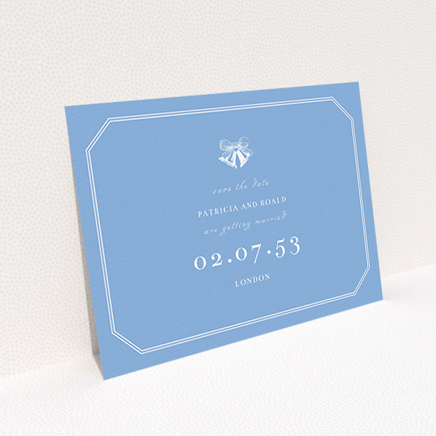 A wedding save the date card named "Wedding bells". It is an A6 card in a landscape orientation. "Wedding bells" is available as a flat card, with tones of blue and white.