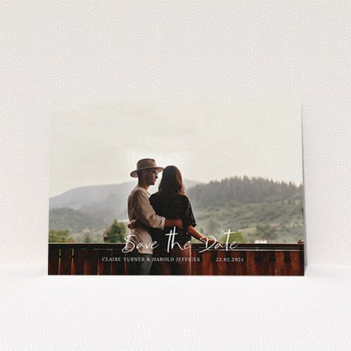 A wedding save the date named "Central Script". It is an A6 save the date in a landscape orientation. It is a photographic wedding save the date with room for 1 photo. "Central Script" is available as a flat save the date, with mainly white colouring.