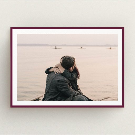 A wedding save the date design named "Classic Burgundy Photo Frame". It is an A5 save the date in a landscape orientation. It is a photographic wedding save the date with room for 1 photo. "Classic Burgundy Photo Frame" is available as a flat save the date, with tones of burgundy and white.