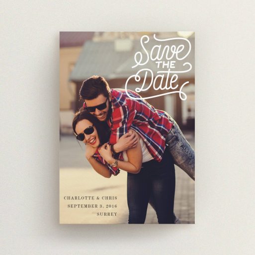 A wedding save the date design called "Curly Typography Photo". It is an A6 save the date in a portrait orientation. It is a photographic wedding save the date with room for 1 photo. "Curly Typography Photo" is available as a flat save the date, with mainly white colouring.