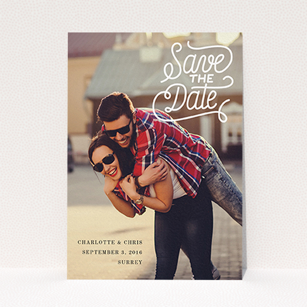 A wedding save the date design called "Curly Typography Photo". It is an A6 save the date in a portrait orientation. It is a photographic wedding save the date with room for 1 photo. "Curly Typography Photo" is available as a flat save the date, with mainly white colouring.