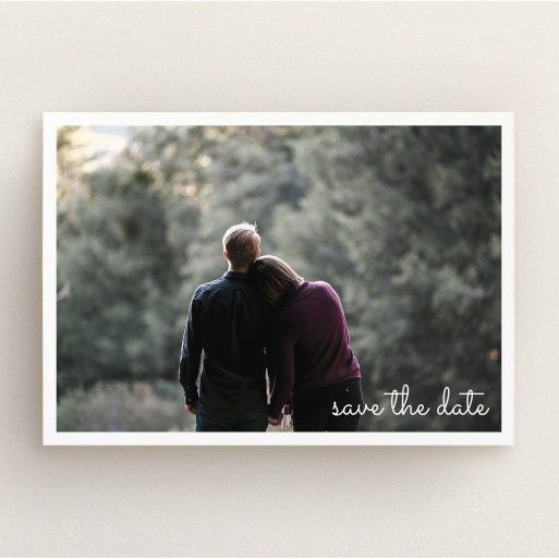 A wedding save the date template titled "Date Saving Photo". It is an A5 save the date in a landscape orientation. It is a photographic wedding save the date with room for 1 photo. "Date Saving Photo" is available as a flat save the date, with mainly white colouring.