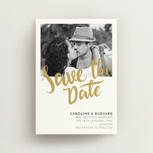 A wedding save the date design called "Gold Typography Photo". It is an A6 save the date in a portrait orientation. It is a photographic wedding save the date with room for 1 photo. "Gold Typography Photo" is available as a flat save the date, with tones of cream and gold.