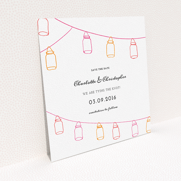 A wedding save the date template titled "In a jar". It is a square (148mm x 148mm) save the date in a square orientation. "In a jar" is available as a flat save the date, with tones of white, orange and pink.