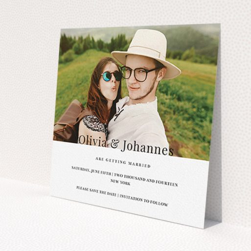 A wedding save the date template titled 'On the fence'. It is a square (148mm x 148mm) save the date in a square orientation. It is a photographic wedding save the date with room for 1 photo. 'On the fence' is available as a flat save the date, with mainly white colouring.
