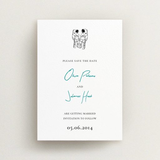 A wedding save the date design named "One small step". It is an A6 save the date in a portrait orientation. "One small step" is available as a flat save the date, with tones of white and blue.