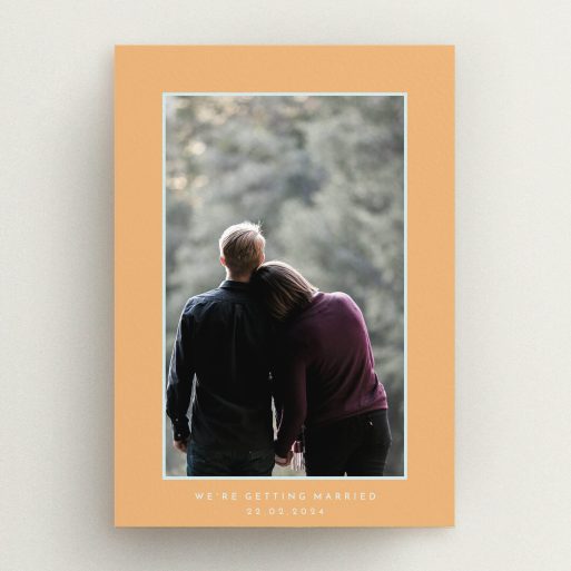 A wedding save the date design called "Orange Mint Photo Frame". It is an A5 save the date in a portrait orientation. It is a photographic wedding save the date with room for 1 photo. "Orange Mint Photo Frame" is available as a flat save the date, with tones of orange and blue.