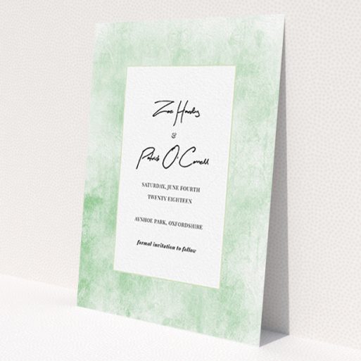 A wedding save the date design called 'Rustic Green'. It is an A6 save the date in a portrait orientation. 'Rustic Green' is available as a flat save the date, with tones of green and white.