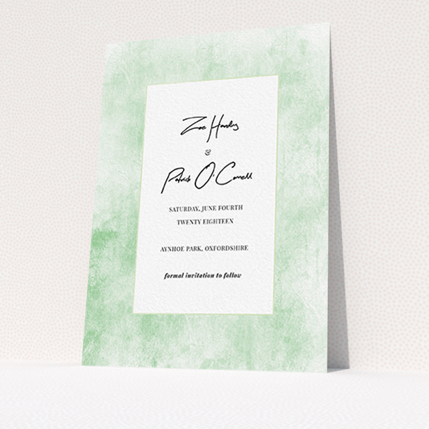 A wedding save the date design called "Rustic Green". It is an A6 save the date in a portrait orientation. "Rustic Green" is available as a flat save the date, with tones of green and white.