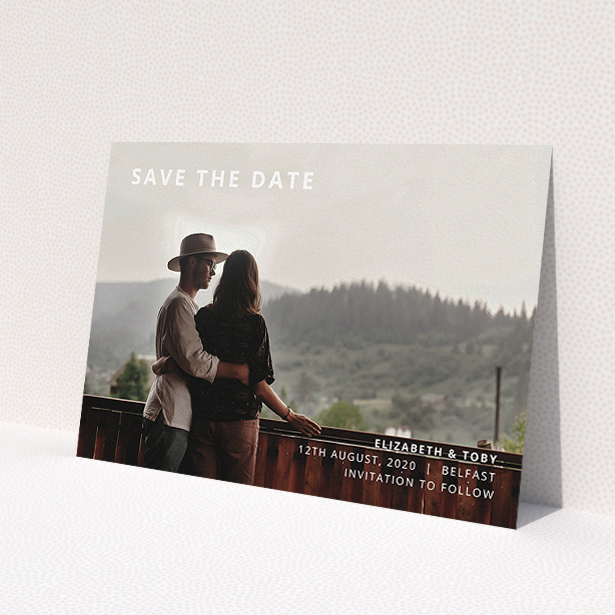 A wedding save the date design called "Sans Serif". It is an A5 save the date in a landscape orientation. It is a photographic wedding save the date with room for 1 photo. "Sans Serif" is available as a flat save the date, with mainly white colouring.
