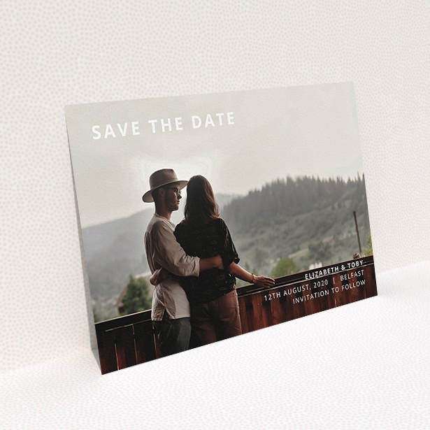 A wedding save the date design called "Sans Serif". It is an A5 save the date in a landscape orientation. It is a photographic wedding save the date with room for 1 photo. "Sans Serif" is available as a flat save the date, with mainly white colouring.