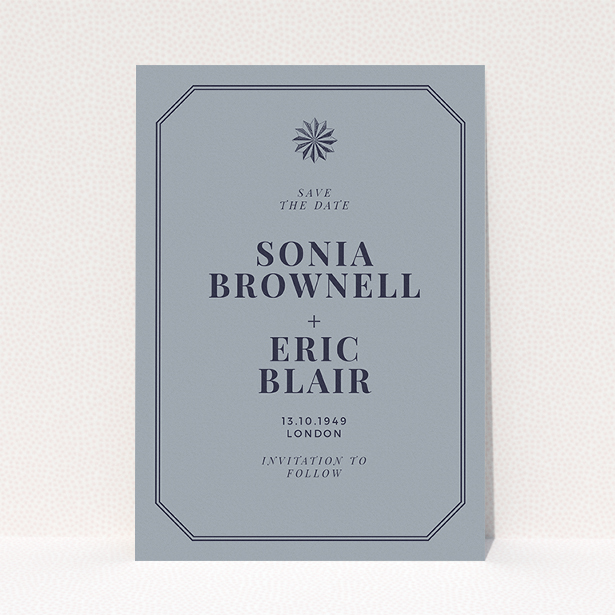 A wedding save the date template titled "Shaded sundial". It is an A5 save the date in a portrait orientation. "Shaded sundial" is available as a flat save the date, with tones of dark grey and navy blue.