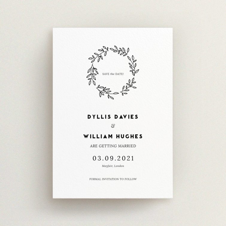 A wedding save the date design titled "Simple Wreath". It is an A6 save the date in a portrait orientation. "Simple Wreath" is available as a flat save the date, with mainly white colouring.