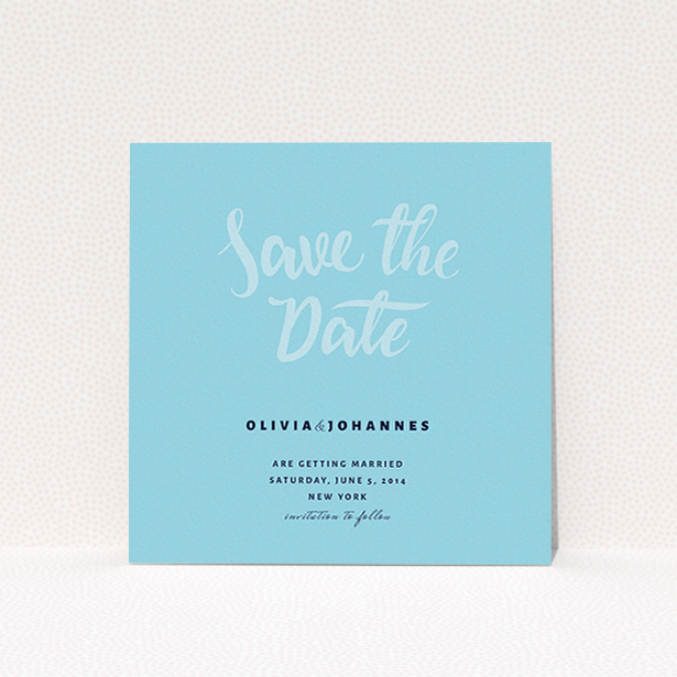 A wedding save the date called "Sky on Blue Typography". It is a square (148mm x 148mm) save the date in a square orientation. "Sky on Blue Typography" is available as a flat save the date, with mainly blue colouring.