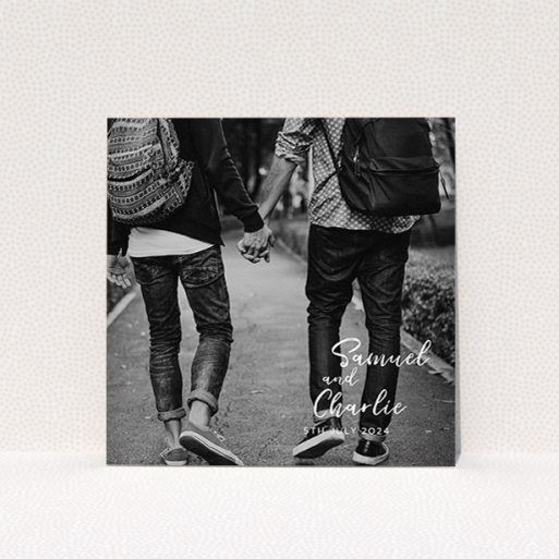 A wedding save the date named "Soho Script". It is a square (148mm x 148mm) save the date in a square orientation. It is a photographic wedding save the date with room for 1 photo. "Soho Script" is available as a flat save the date, with mainly white colouring.