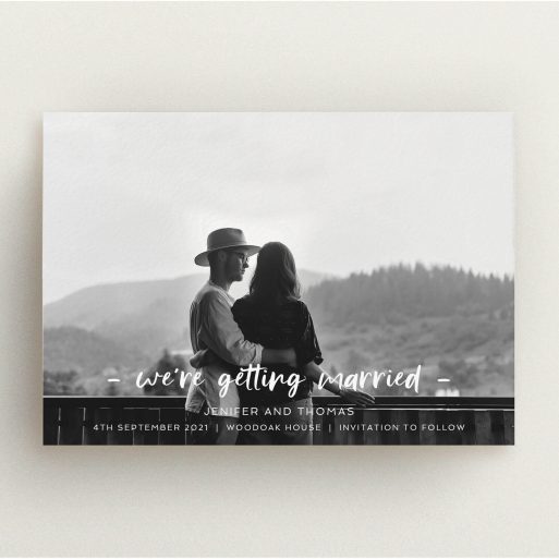 A wedding save the date called "To the Point". It is an A5 save the date in a landscape orientation. It is a photographic wedding save the date with room for 1 photo. "To the Point" is available as a flat save the date, with mainly white colouring.