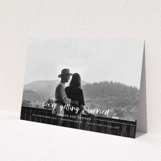 A wedding save the date called 'To the Point'. It is an A5 save the date in a landscape orientation. It is a photographic wedding save the date with room for 1 photo. 'To the Point' is available as a flat save the date, with mainly white colouring.